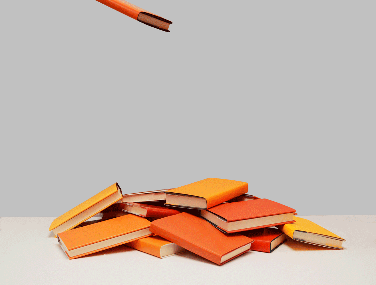 Books falling from the sky into a pile.